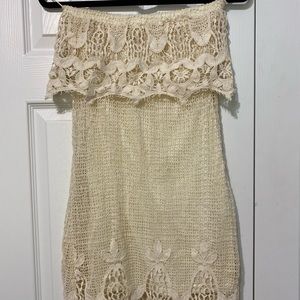 A.Peach strapless crochet dress in cream.